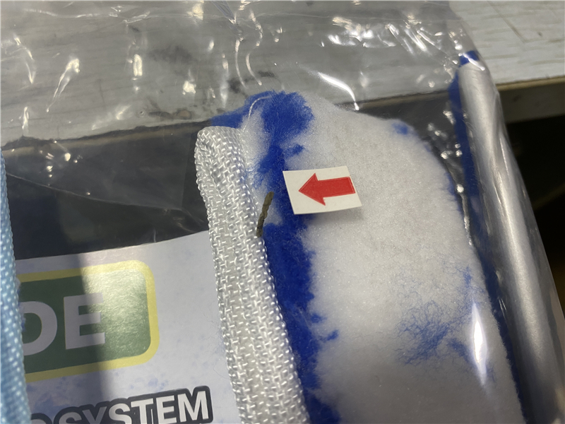 Representative close-up of a visible material impurity marked for inspection review