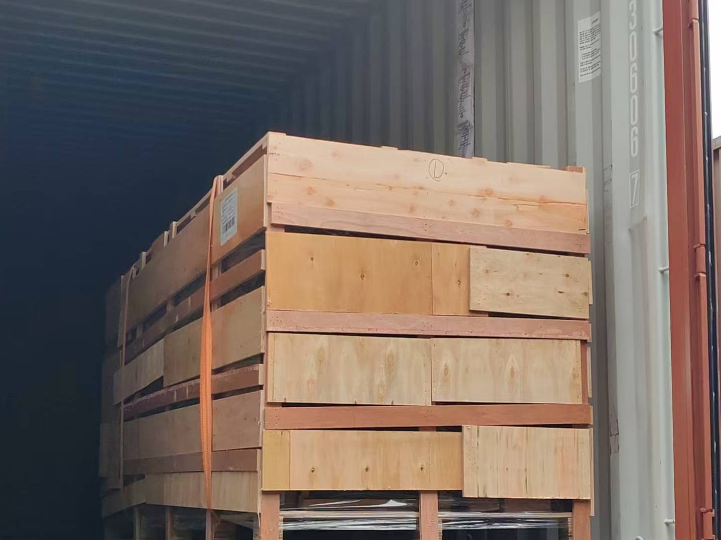 Close view of secured wooden cargo inside a shipping container